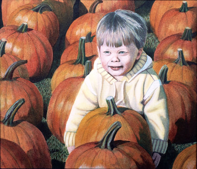 toddler picking a pumpkin
